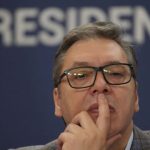 Serbian President Aleksandar Vucic gestures during a public address, a day after one of the biggest protests in years in Belgrade, Serbia, Sunday, Aug. 11, 2024. Vucic said earlier he had been tipped off by Russian intelligence services that a "mass unrest and a coup" were being prepared in Serbia by unspecified Western powers that wish to oust him from power. (AP Photo/Darko Vojinovic)