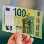 A worker holds the new 100 euros banknote at the end of the printing procedure at the Bankitalia, the Italian national central bank, high-security factory in Rome, on May 20, 2019. - The ECB allocates production volumes to different national central banks, which then supply a specific proportion of the total annual production. The banknotes are subsequently distributed among the different national central banks. (Photo by Vincenzo PINTO / AFP)